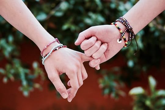 two girls holding hands