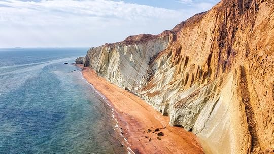 The island glows in shades of red, yellow and orange due to the more than 70 minerals found here (Credit: Lukas Bischoff/Alamy)