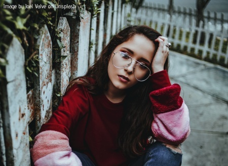 Sad woman sitting on the ground