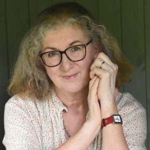 Headshot of Debbie Young with greying hair