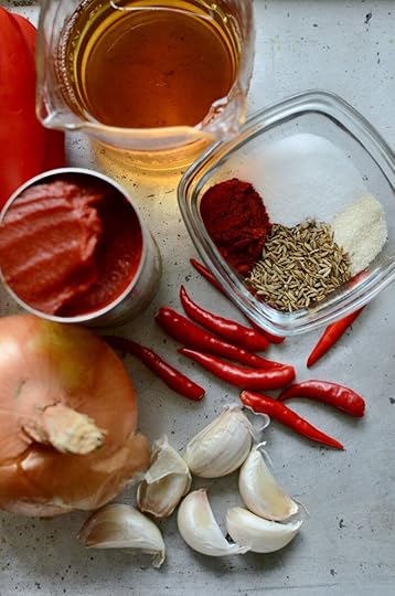 More harissa ingredients. Garlic, onion, bird's eye chilies, tomato paste, and spices.
