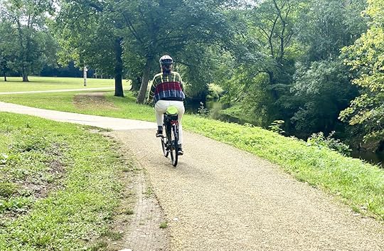 View of a woman riding an e-bike in the Loire Valley