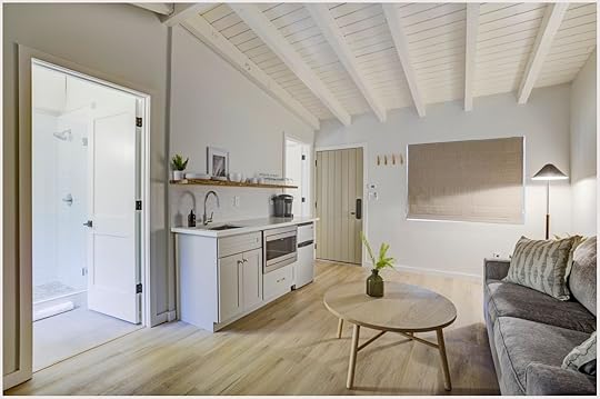 A white, modern suite with a small kitchen at South Lake Chalets, a popular Lake Tahoe hotel