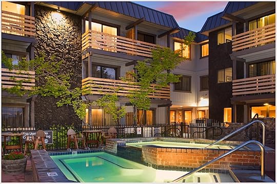 The courtyard and pool at Hotel Azure in the evening