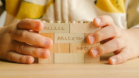 child playing with mokulock lego toys