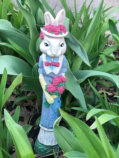 Tall skinny bunny in old-fashioned blue dress