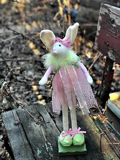 tall thin bunny in flowing pink dress, very long legs, big green shoes