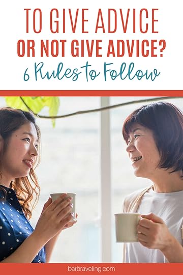 older Asian woman giving advice to a younger woman