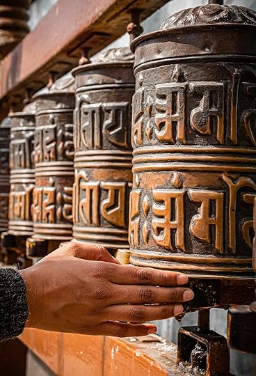 Hand turning Tibetan prayer wheels