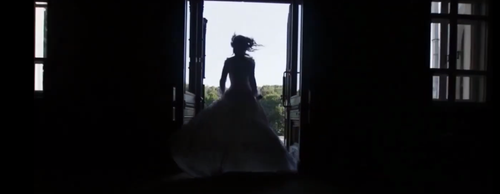 woman running through a door