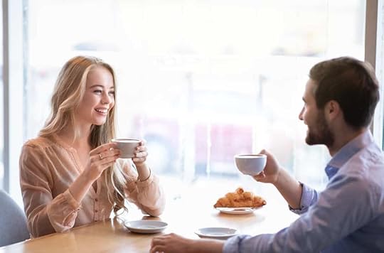 Man and woman talking at cafe flirty questions to ask a girl