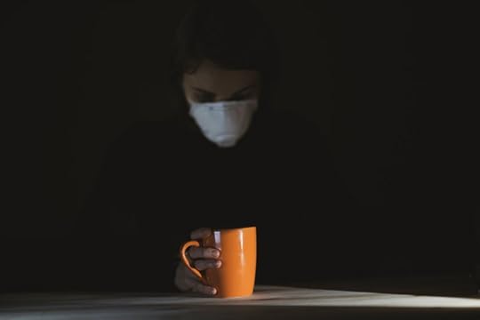introvert sitting alone with a surgical mask on