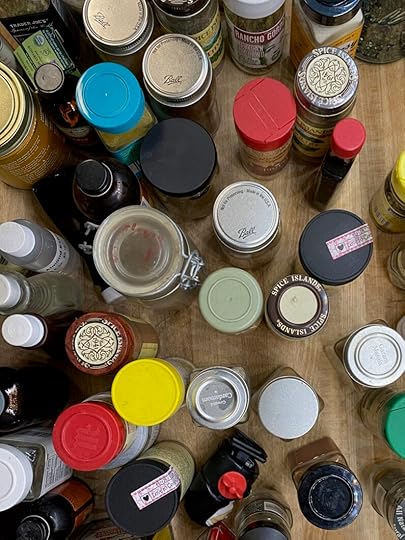 Overhead image of spice jars before cleaning and decanting.
