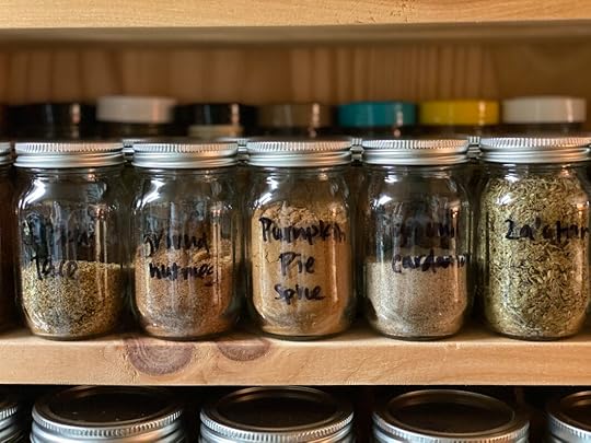 Close up of Ball® Mini Storage Jars filled with spices.
