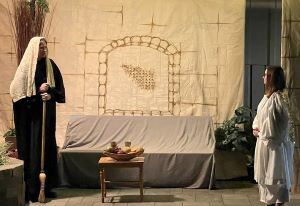 Two actors depict the angel greeting Mary