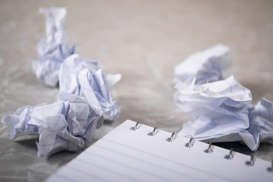 Crumpled paper and a notepad.