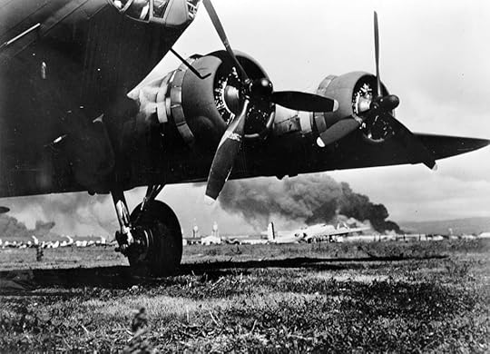 Lt. Karl T. Barthelmess’s B-17E at Hickam Air Field, after landing safely during the Japanese air raid, 7 Dec 1941; note smoke rising from Pearl Harbor (US National Archives: SC 127002)