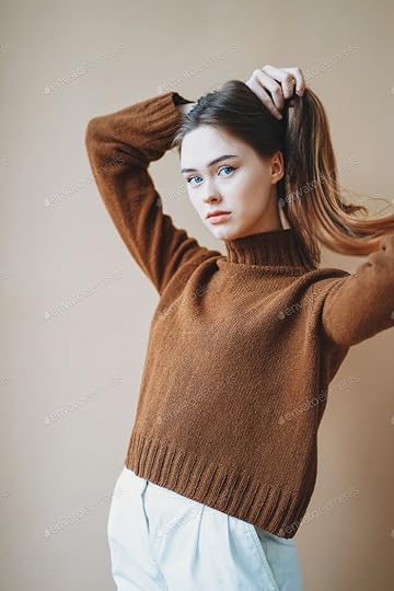 Young beautiful long hair girl with blue eyes in brown knitted sweater looking at camera photo by GalinkaZhi on Envato Elements