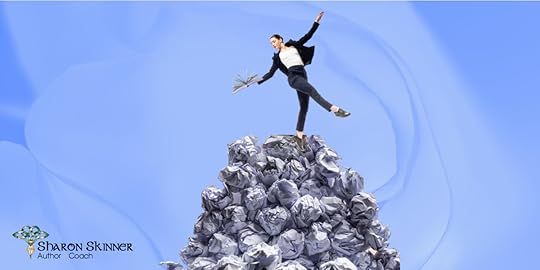 Woman holding book dances on top of mound of crumpled discarded pages to represent conquering revision.