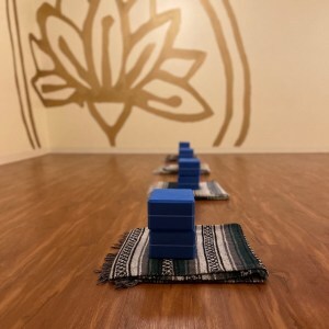 a prop station with a blanket and two blocks