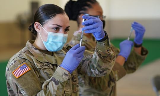 Spc. Kailee Soares prepares a dose of COVID-19 vaccine during a drive to vaccinate Hawaii National Guardsmen assigned to the COVID-19 task force response on Kauai Island on Jan. 12, 2021. (U.S. Air National Guard /Master Sgt. Andrew Jackson)