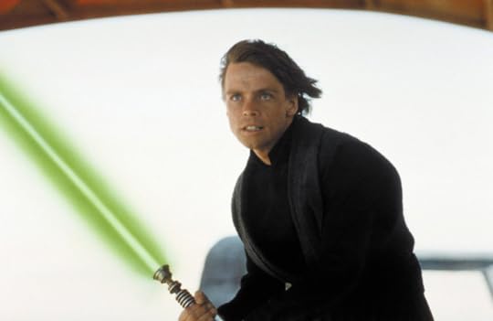 Mark Hamill, as Luke Skywalker, brandishing a light saber against a background of white sky