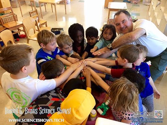 Fun Science with Daniel G. Benes: a photo of Daniel with young students in a classroom.