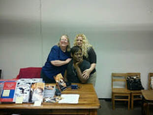 Three author friends at the first Indie Vengeance Day book signing event. From left to right Lynn Hallbrooks, Tracy James Jones, Charity Parkerson