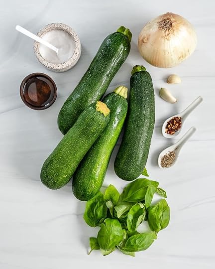 ingredients for zucchini basil soup of 4 zucchinis, basil leaves, onion, and spices