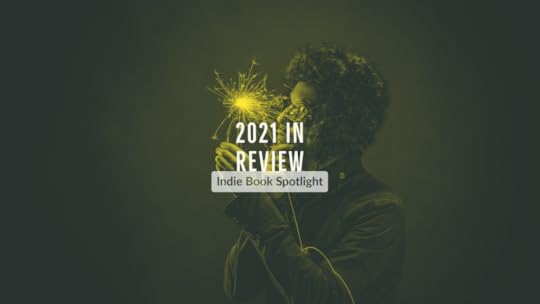 a man holding a sparkler, text reads '2021 in review, indie book spotlight'