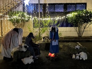 Shepherds gather around a fire on a cold Judean night