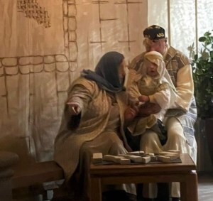 Toddler Jesus and his parents greet the wise men