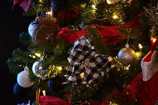 Closeup of a decorated Christmas tree with ornaments and white lights