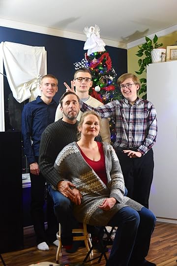 Winters family photo, Jabin making bunny ears over Jason's head