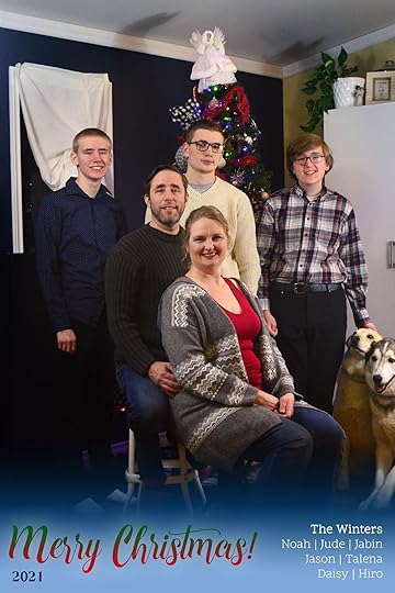 Family photo of the Winters in front of the Christmas tree