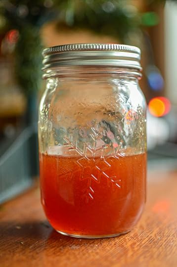 Finished mulled apple cider syrup in a Ball Snowflake Jar.