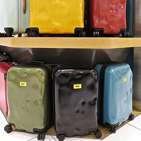 Pre-dinged suitcases