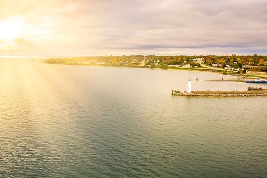 Aerial view of a lighthouse on the shoreline in Michigan