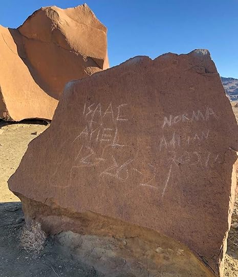 Rock art vandalized in Big Bend National Park in Texas. The art was damaged by people who scratched their names and dates across the piece.