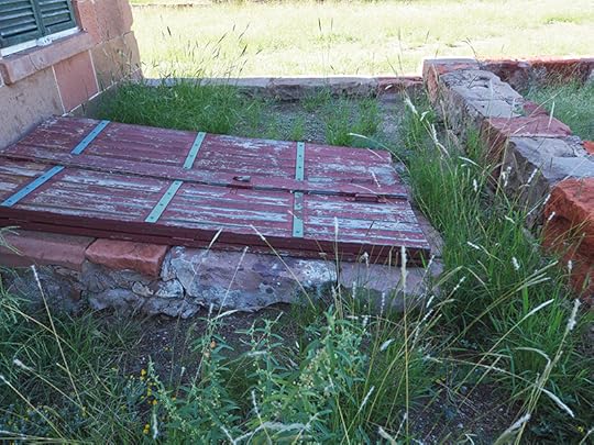 Photo of closed doors to the root cellars where vegetables were stored since there was no refrigeration.