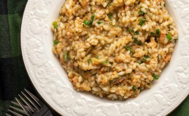 A bowl full of salmon risotto.