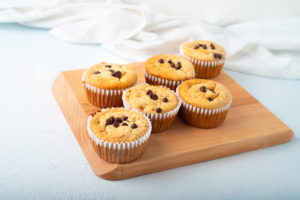 flourless blender muffins in white liner on cutting board gluten free blogilates