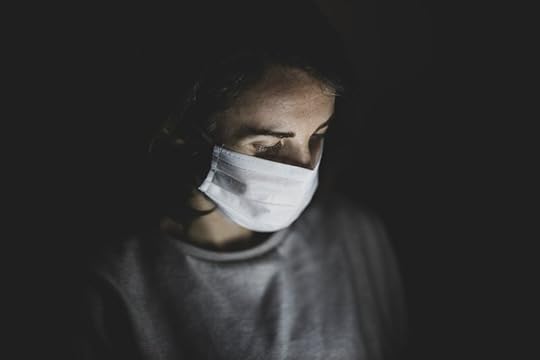 girl in the dark with a face mask