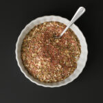 mixed taco seasoning in small white ramekin.