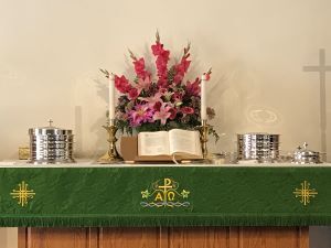 Christian church altar with flowers and communion elements