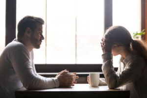 Coworkers having a private conversation over coffee