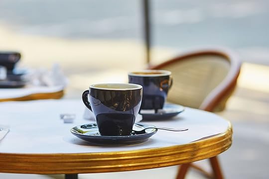 Table at a Parisian café with empty cups of coffee. Ordering a cappuccino in Paris is supposed to be one of the things you should avoid doing in Paris