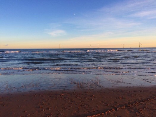 walking on the beach: wind turbines