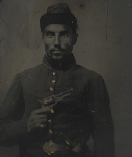 A Black Union solider poses with his pistol held across his chest