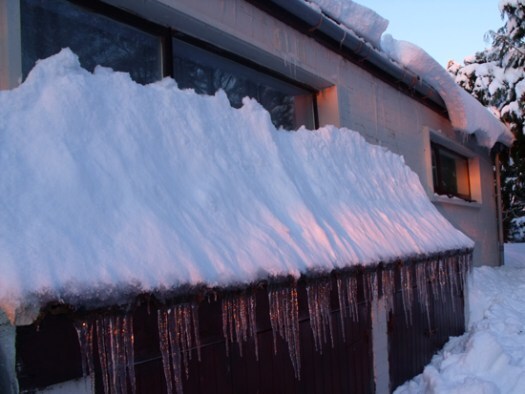 wood shed in the snow